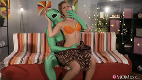 Horny green alien does the deed with a demure blonde darling