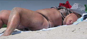 Huge boobs huge ass on a beach