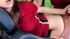 Ravishing lady in a red dress is sucking dick in the car, before getting stuffed with it