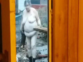 Fat mature wife brings in firewood