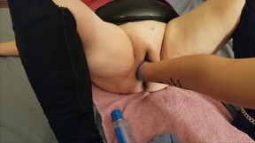 She gets her cunt stretched with a speculum while she moans like a bitch