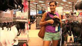 Randy babe flashing her boobs in the department store