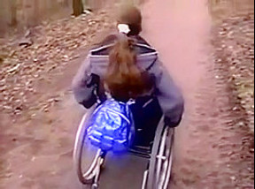 Wheelchair girl outdoor fun