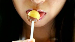 Depraved Asian hottie Yumi Ishikawa licks two lollipops