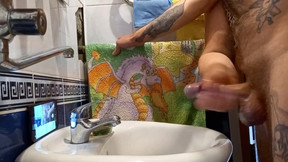 in the bathroom, a girl helps me masturbate my cock.