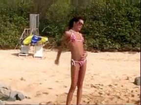 Nude beach - college girl photo shoot pee
