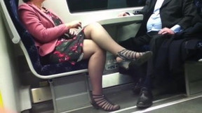 Mature with sexy legs in the train