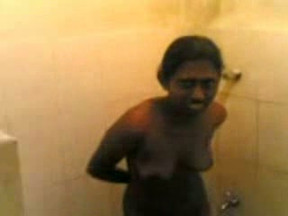 Dark skinned Sri Lankan roommate takes shower while I film her