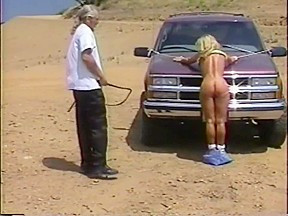 Big Tit Milf Tied to Truck and Whippped