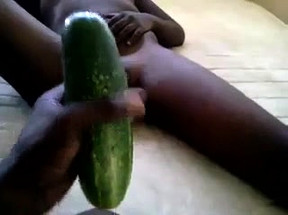 Cute black girl takes a cucumber in her tight pink pussy