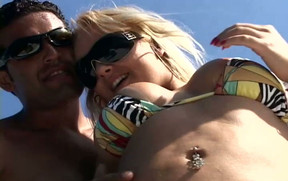 Horny blondie in sunglasses strips on the yacht for winning a stiff dick